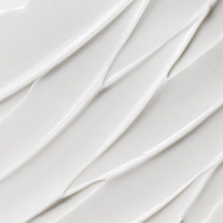 Close-up texture of Tropic Feel Fresh Soothing Deodorant and Antiperspirant Cream with smooth, creamy white consistency.